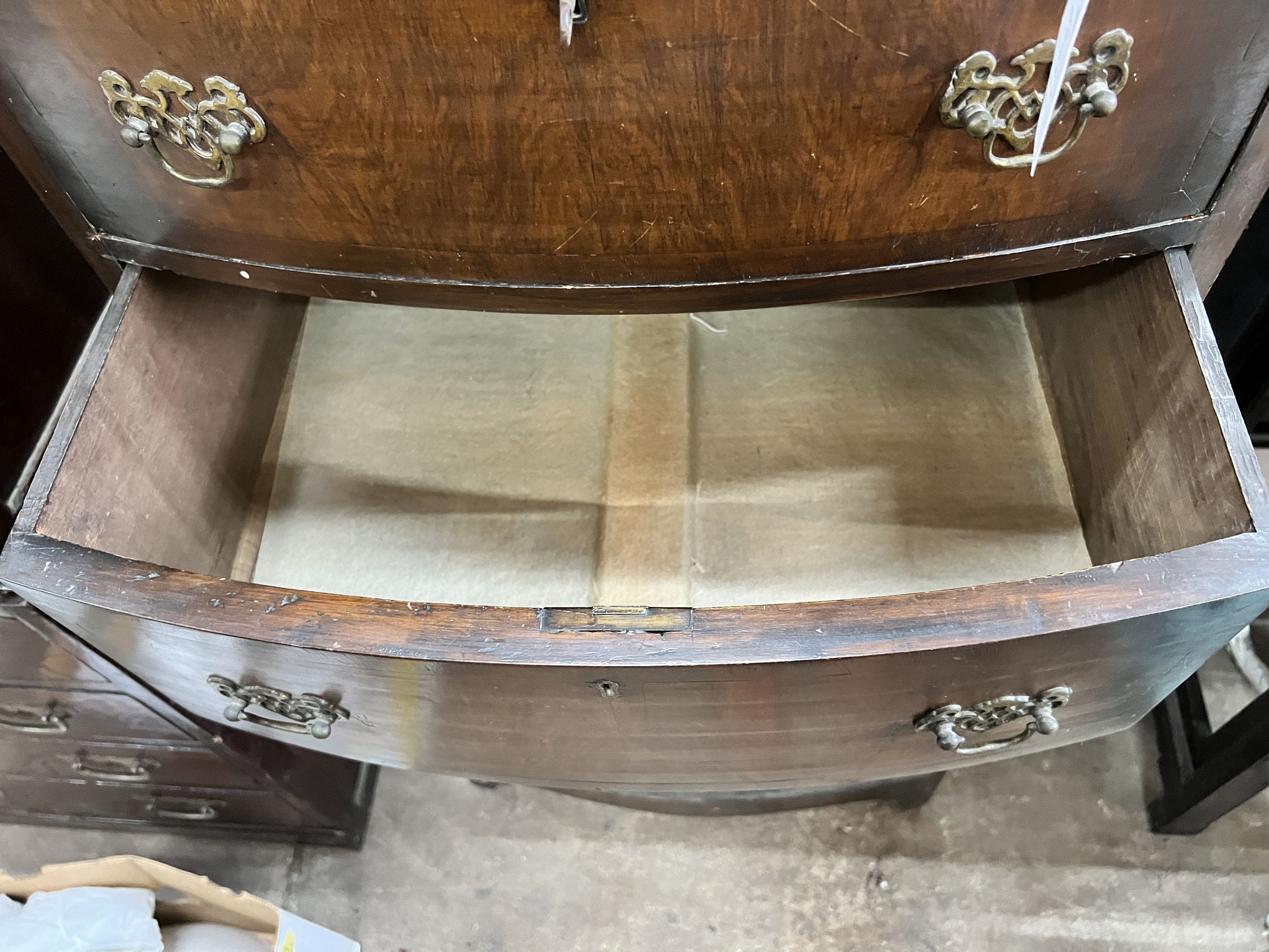 A narrow Queen Anne revival walnut bowfront tallboy, width 60cm, depth 40cm, height 157cm